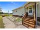 Charming home featuring a cozy front entrance with a wood staircase and a well-maintained exterior at 307 Nc Hwy 49 S Hwy, Richfield, NC 28137