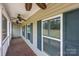 Inviting covered front porch with ceiling fans and lots of light at 307 Nc Hwy 49 S Hwy, Richfield, NC 28137