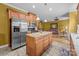 Open concept kitchen with island, stainless appliances and sightlines into the living spaces at 307 Nc Hwy 49 S Hwy, Richfield, NC 28137