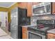 Kitchen with stainless steel appliances, granite countertops and custom backsplash, plus laundry access at 307 Nc Hwy 49 S Hwy, Richfield, NC 28137