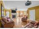 Open living room with hardwood floors, a fireplace, large windows and comfortable leather seating at 307 Nc Hwy 49 S Hwy, Richfield, NC 28137