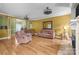Inviting living room features hardwood floors, fireplace and two sofas with lots of natural light at 307 Nc Hwy 49 S Hwy, Richfield, NC 28137