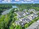 Aerial view of a neighborhood on a lake with lush landscaping, docks, and a waterfront at 329 Wave Crest Dr, Tega Cay, SC 29708