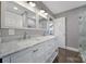 Bathroom featuring a double sink vanity, marble countertop and open doorway at 329 Wave Crest Dr, Tega Cay, SC 29708