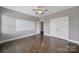 Spacious bedroom with hardwood floors, a ceiling fan, and a large closet at 329 Wave Crest Dr, Tega Cay, SC 29708