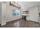 Charming dining area with hardwood floors, wine cooler, and large window for natural light at 329 Wave Crest Dr, Tega Cay, SC 29708