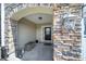 Welcoming front porch with stone archway, stylish decor, and a cozy entrance at 329 Wave Crest Dr, Tega Cay, SC 29708