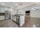 Kitchen featuring stainless steel appliances, granite counter tops and flows into the living room at 329 Wave Crest Dr, Tega Cay, SC 29708