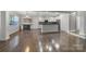 Open concept kitchen with a large island, stainless steel appliances, and beautiful hardwood floors at 329 Wave Crest Dr, Tega Cay, SC 29708