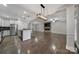 Bright kitchen with granite countertops, stainless steel appliances, and hardwood floors, open to the living area at 329 Wave Crest Dr, Tega Cay, SC 29708