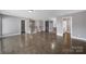 Spacious living room with hardwood floors, open layout, and stylish barn door at 329 Wave Crest Dr, Tega Cay, SC 29708