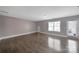 Bright living room with hardwood floors, neutral walls, and a door to the outdoor patio at 329 Wave Crest Dr, Tega Cay, SC 29708