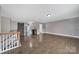 Open-concept living room with hardwood floors and a barn door accent at 329 Wave Crest Dr, Tega Cay, SC 29708
