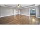 Spacious main bedroom with hardwood floors, ceiling fan, and ensuite bathroom at 329 Wave Crest Dr, Tega Cay, SC 29708