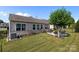 This backyard features a patio with landscaping and mature trees at 4022 Perth Rd, Indian Land, SC 29707