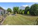 This backyard features manicured landscaping and a patio with a firepit at 4022 Perth Rd, Indian Land, SC 29707