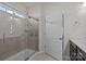 Modern bathroom with a glass-enclosed shower, tiled walls, and a neutral color scheme, offering a spa-like experience at 4022 Perth Rd, Indian Land, SC 29707