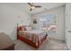 Bright bedroom featuring a window, ceiling fan, carpet floors and a decorative bed at 4022 Perth Rd, Indian Land, SC 29707
