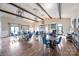 Spacious clubhouse room with tables, chairs, hardwood floors and ample natural light at 4022 Perth Rd, Indian Land, SC 29707