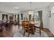 Inviting dining area features a round table with seating for four and ample natural light, great for Gathering gatherings at 4022 Perth Rd, Indian Land, SC 29707