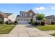 Two-story home with a 2 car garage, manicured lawn and landscaping plus a large concrete driveway at 4022 Perth Rd, Indian Land, SC 29707