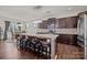 Spacious kitchen featuring a large island with bar seating, granite countertops, and modern stainless-steel appliances at 4022 Perth Rd, Indian Land, SC 29707