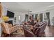 Cozy living room with a fireplace, comfortable seating, and hardwood floors at 4022 Perth Rd, Indian Land, SC 29707