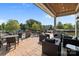 Covered patio with outdoor seating and a view of trees and community amenities at 4022 Perth Rd, Indian Land, SC 29707