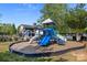 Community playground with slides, climbing structures, and soft ground cover for safety at 4022 Perth Rd, Indian Land, SC 29707