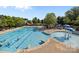 Aerial view of a community pool with people swimming and lounging poolside at 4022 Perth Rd, Indian Land, SC 29707