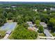 An aerial view showcases the lush neighborhood, highlighting nearby community tennis courts at 419 Solomon St, Charlotte, NC 28216