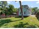 Spacious backyard with lush green grass and mature trees at 419 Solomon St, Charlotte, NC 28216