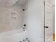 Stylish bathroom featuring a tiled shower and tub with matte black fixtures at 419 Solomon St, Charlotte, NC 28216