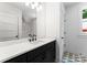 Modern bathroom features a single vanity with black fixtures, and patterned tile flooring at 419 Solomon St, Charlotte, NC 28216