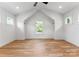 Spacious bedroom with hardwood floors and multiple windows for ample natural light at 419 Solomon St, Charlotte, NC 28216