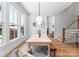 Bright dining room with hardwood floors and windows overlooking the yard at 419 Solomon St, Charlotte, NC 28216