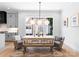 Bright dining room with farmhouse table, pendant lighting, and large windows at 419 Solomon St, Charlotte, NC 28216
