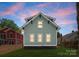 Charming home featuring a well-maintained lawn and newly painted exterior, exuding curb appeal and modern comfort at 419 Solomon St, Charlotte, NC 28216