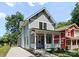 Charming two-story home with a welcoming front porch and landscaped yard at 419 Solomon St, Charlotte, NC 28216