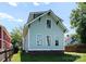 Back exterior of home with light blue siding, black trim, and well-kept lawn at 419 Solomon St, Charlotte, NC 28216