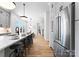 Spacious kitchen with seating at the large island, gray cabinetry, and stainless appliances at 419 Solomon St, Charlotte, NC 28216