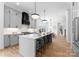 Modern kitchen with gray cabinetry, stainless steel appliances, and a large center island at 419 Solomon St, Charlotte, NC 28216