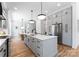 Modern kitchen with gray cabinets, stainless steel appliances, and an island at 419 Solomon St, Charlotte, NC 28216