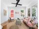 Bright living room featuring hardwood floors and a ceiling fan at 419 Solomon St, Charlotte, NC 28216