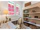 Cozy home office features a built-in bookshelf, large windows, and charming decor at 419 Solomon St, Charlotte, NC 28216