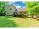Home with a beautiful green backyard featuring a well-manicured lawn and a wooden deck at 4203 Flint Dr, Lancaster, SC 29720