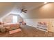 Bright carpeted bedroom with vaulted ceilings, fan, window and soft pink accents at 4203 Flint Dr, Lancaster, SC 29720