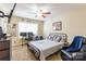 Bedroom featuring fan, carpet and a TV, plus a desk with monitors for gaming or work at 4203 Flint Dr, Lancaster, SC 29720