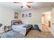 Bedroom featuring fan, carpet and walls with artwork of Pokémon characters adorning walls at 4203 Flint Dr, Lancaster, SC 29720