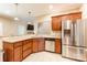 Bright kitchen boasts stainless appliances, granite counters, tile backsplash, and view to the living space at 4203 Flint Dr, Lancaster, SC 29720